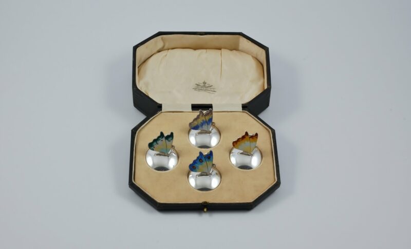 Set of 4 silver and enamel butterfly menu holders, Birmingham 1926.