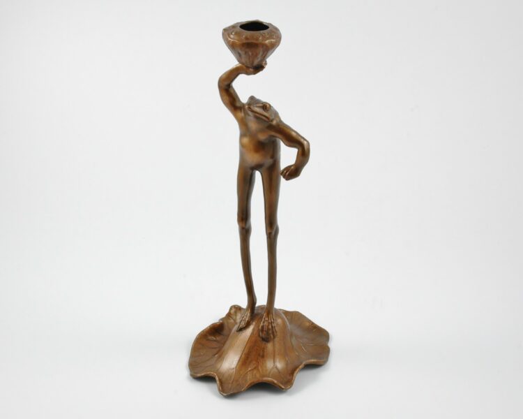 An English Art Nouveau bronzed metal frog candlestick retailed by Liberty & Co. Circa 1900.