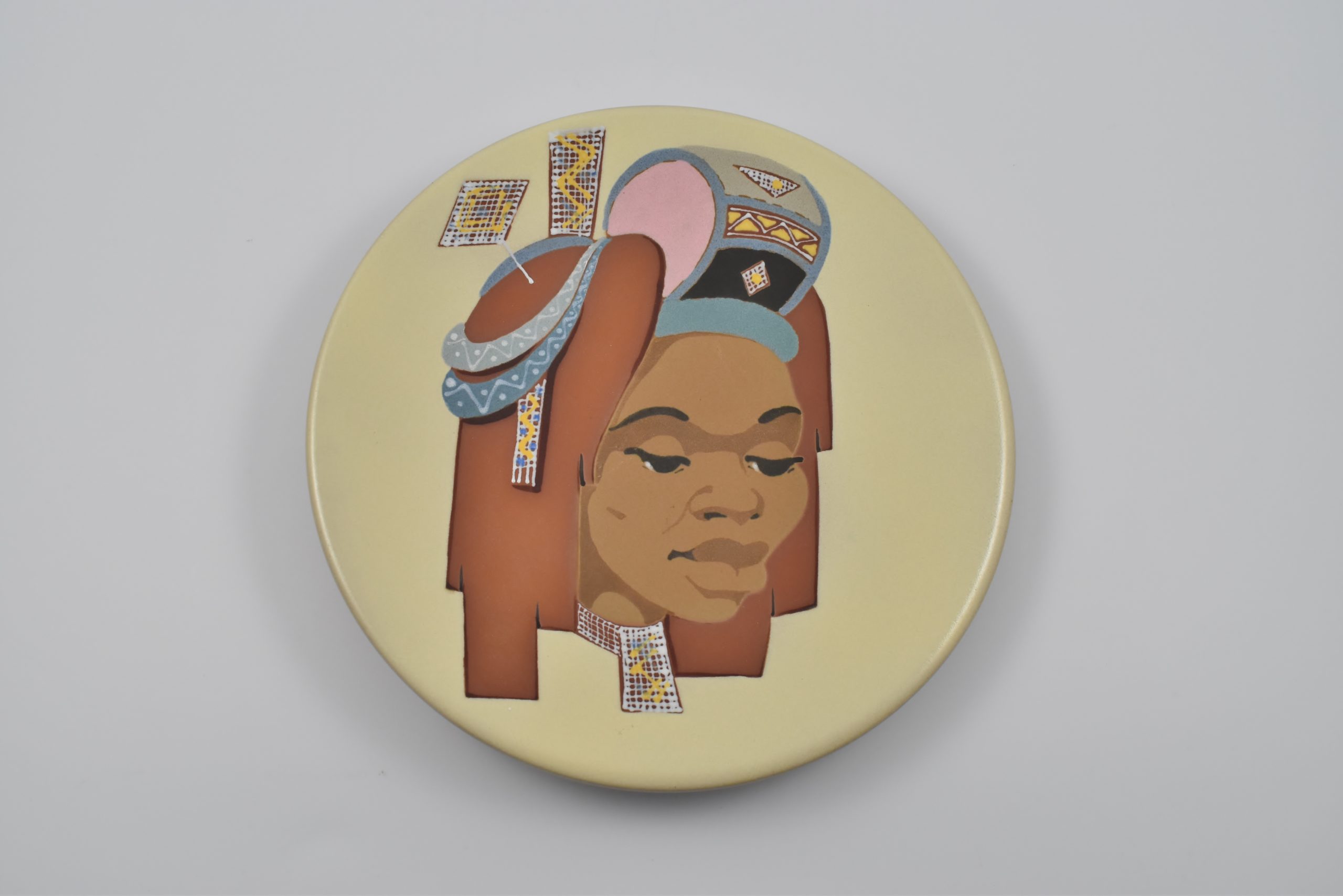 Kalahari Studio charger, Circa 1955- Lady with headdress.