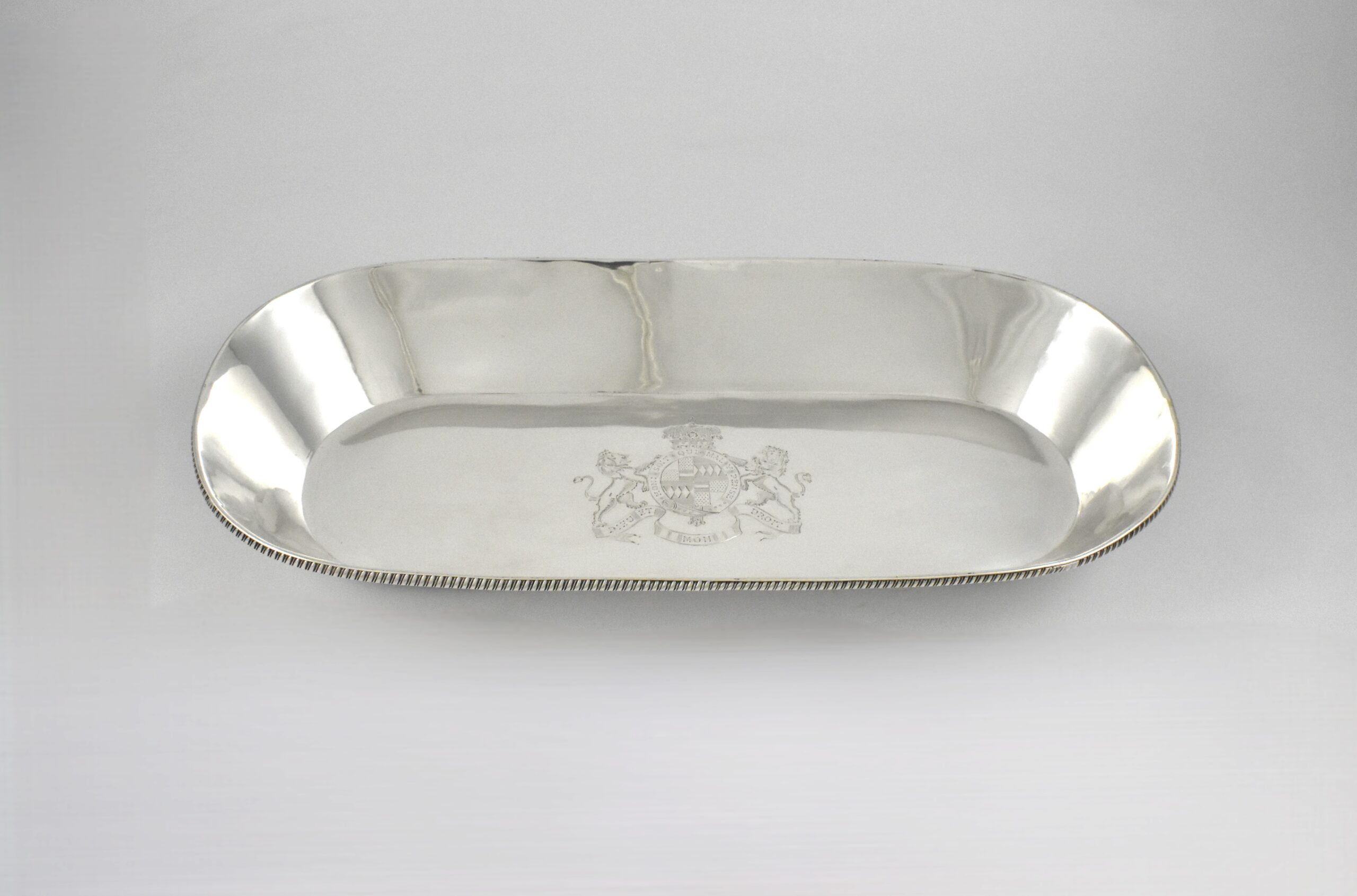 George III silver knife tray marked for London 1802 by William Frisbee engraved with the Royal coat of arms and Latin motto’s- “Honi Soit Qui Mal Y Pense” (Shame on anyone who thinks evil of it) and “Dieu Et Mon Droit’ (God and my right shall me defend’).
