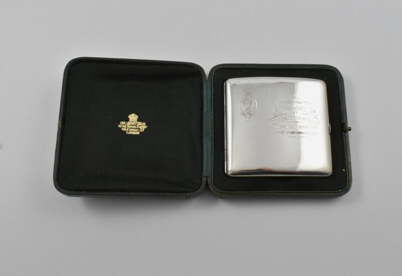Royal presentation silver cigarette case marked for London 1905 in its original box with the Royal crest and the motto: HONI SOIT QUI MAL Y PENSE’ which translates as "Shame on anyone who thinks evil of it" to C. B Oakley from H.R.H THE PRINCE OF WALES, NARSEMPETT, DECCAN INDIA, FEBRUARY 1906 by James Samuel Bell & Louis Willmott, Retailed by Collingwood & Co- to the Royal Family, 46 Conduit St, London.