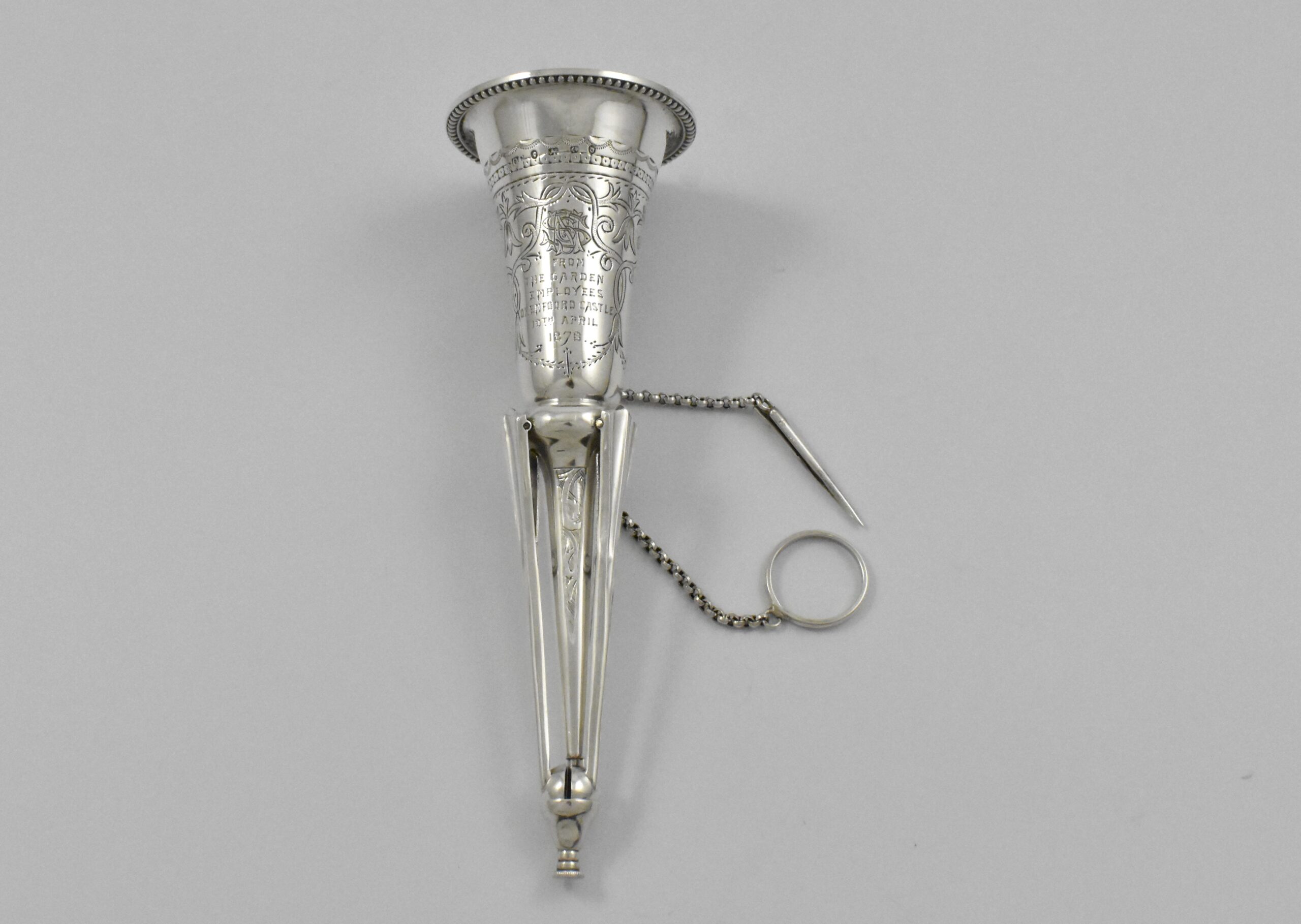 Victorian silver posy holder with finger ring and flower pin marked for London 1878. Incorporated into the handle are three sprung legs allowing it to stand. Engraved: “FROM THE GARDEN EMPLOYEES OXENFOORD CASTLE 10TH APRIL1878” by Colen Hewer Cheshire. - Image 3