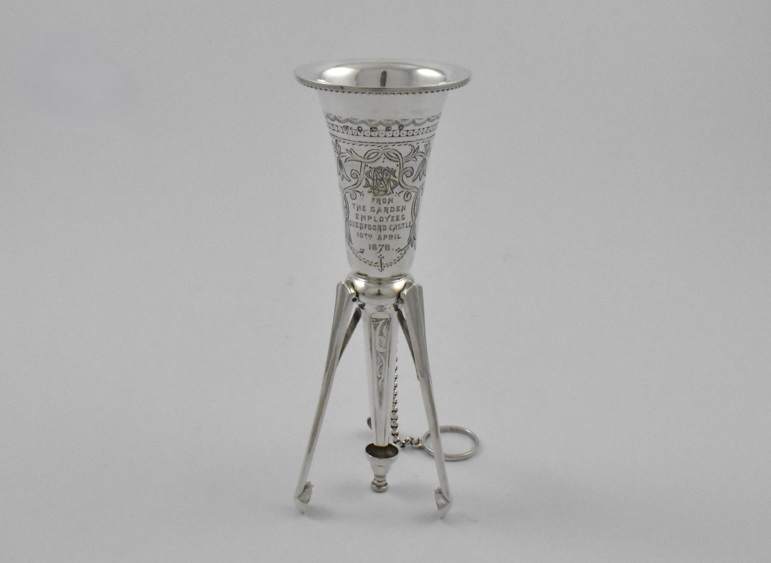 Victorian silver posy holder with finger ring and flower pin marked for London 1878. Incorporated into the handle are three sprung legs allowing it to stand. Engraved: “FROM THE GARDEN EMPLOYEES OXENFOORD CASTLE 10TH APRIL1878” by Colen Hewer Cheshire. - Image 4