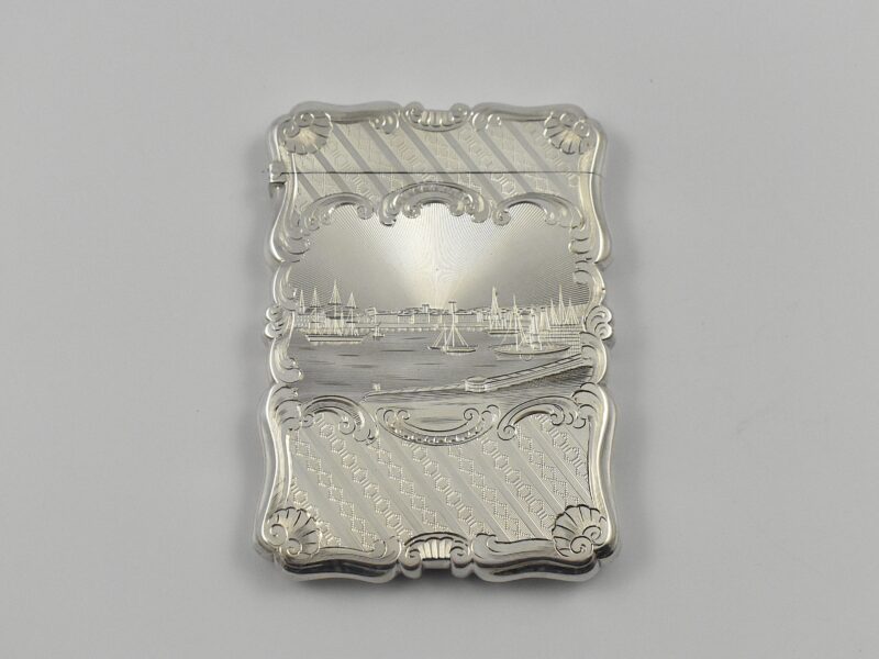 Victorian silver castle top card case marked for Birmingham 1848 by Nathaniel Mills, finely engraved with a Harbour scene- currently unidentified in its original box.