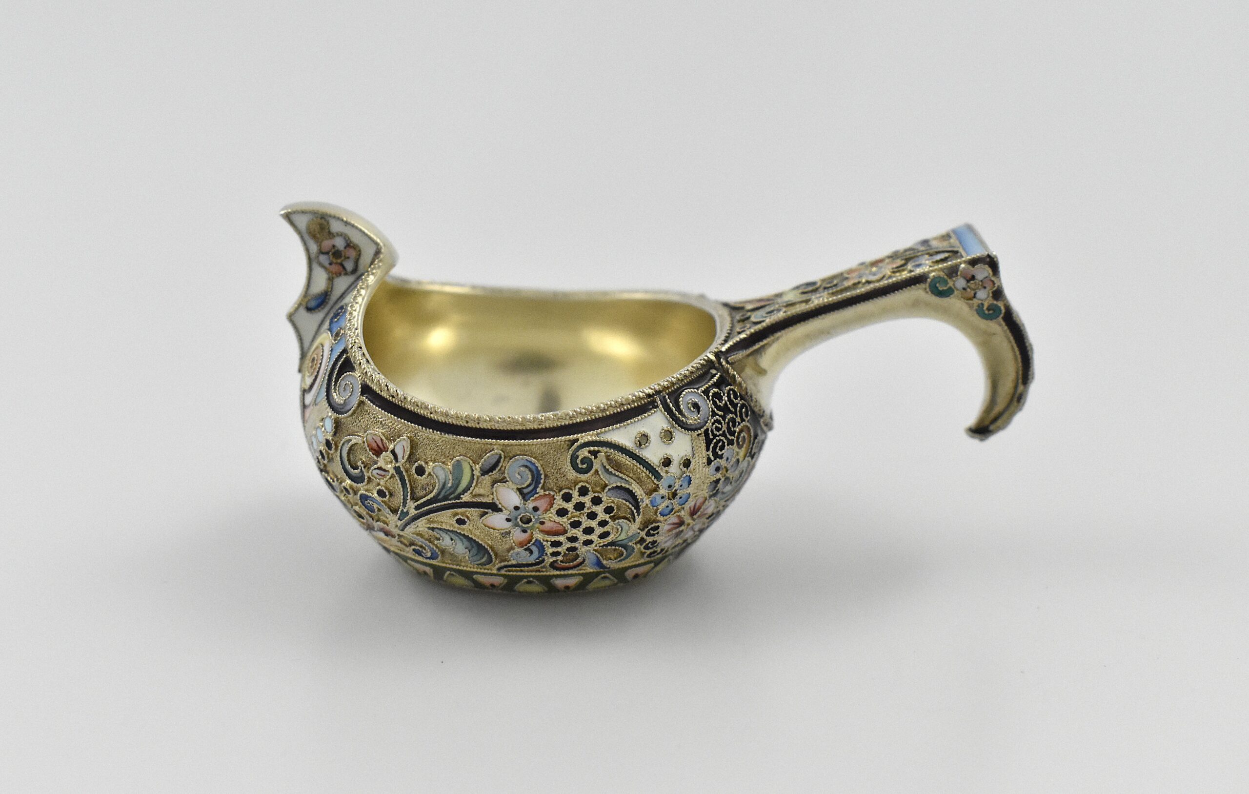Russian ‘84’ silver gilt and shaded enamel Kovsh, Moscow 1908 to 1926, by the 11th Artel- an important group of workers highly influenced by the Art Nouveau style.