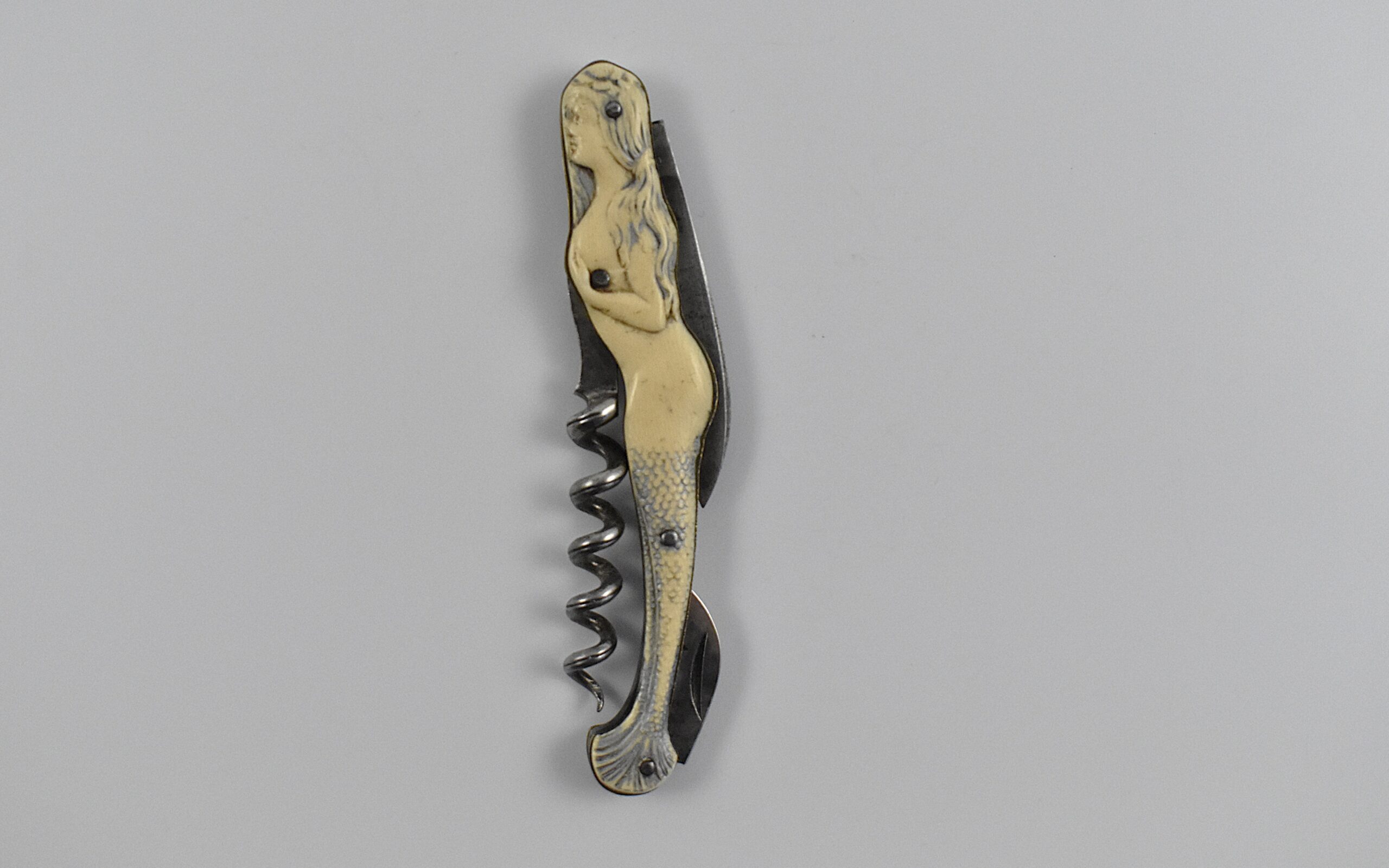 A rare German ‘Waiters Friend’ corkscrew with celluloid scales in the form of an Art Nouveau styled mermaid by GRAEFT & SCHMIDT.