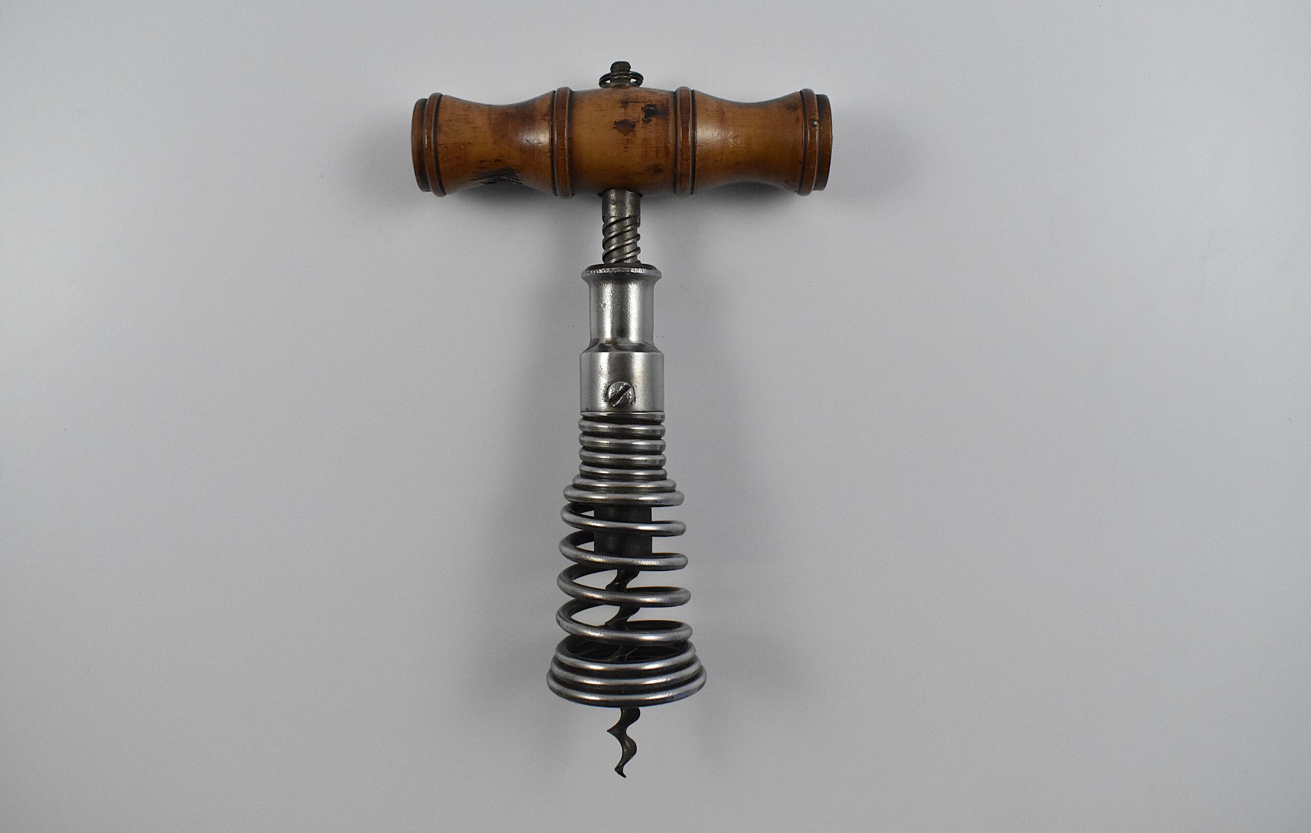 A German corkscrew with cone shaped coiled spring barrel which was a registered design No. 65,555 granted to Georg Giessler on October the 14th 1896.