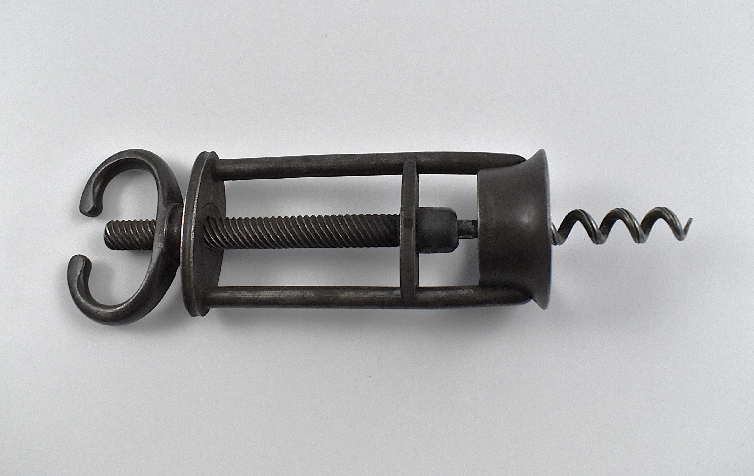 An English open frame two pillar corkscrew with a fixed wing nut handle retailed by B B WELLS of 431 WEST ST STRAND. - Image 3
