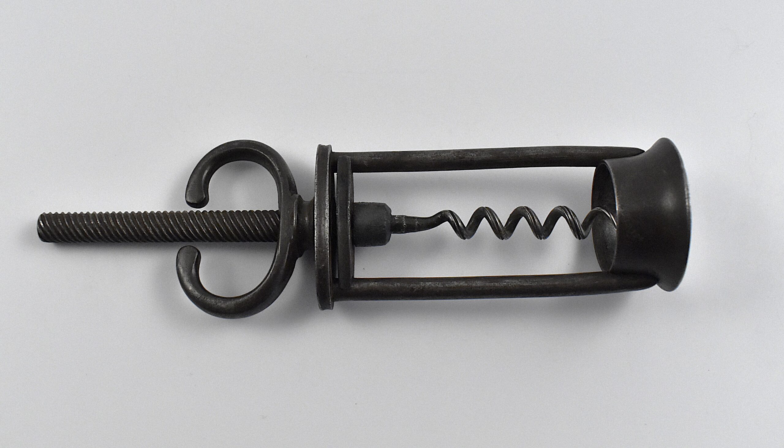 An English open frame two pillar corkscrew with a fixed wing nut handle retailed by B B WELLS of 431 WEST ST STRAND. - Image 4
