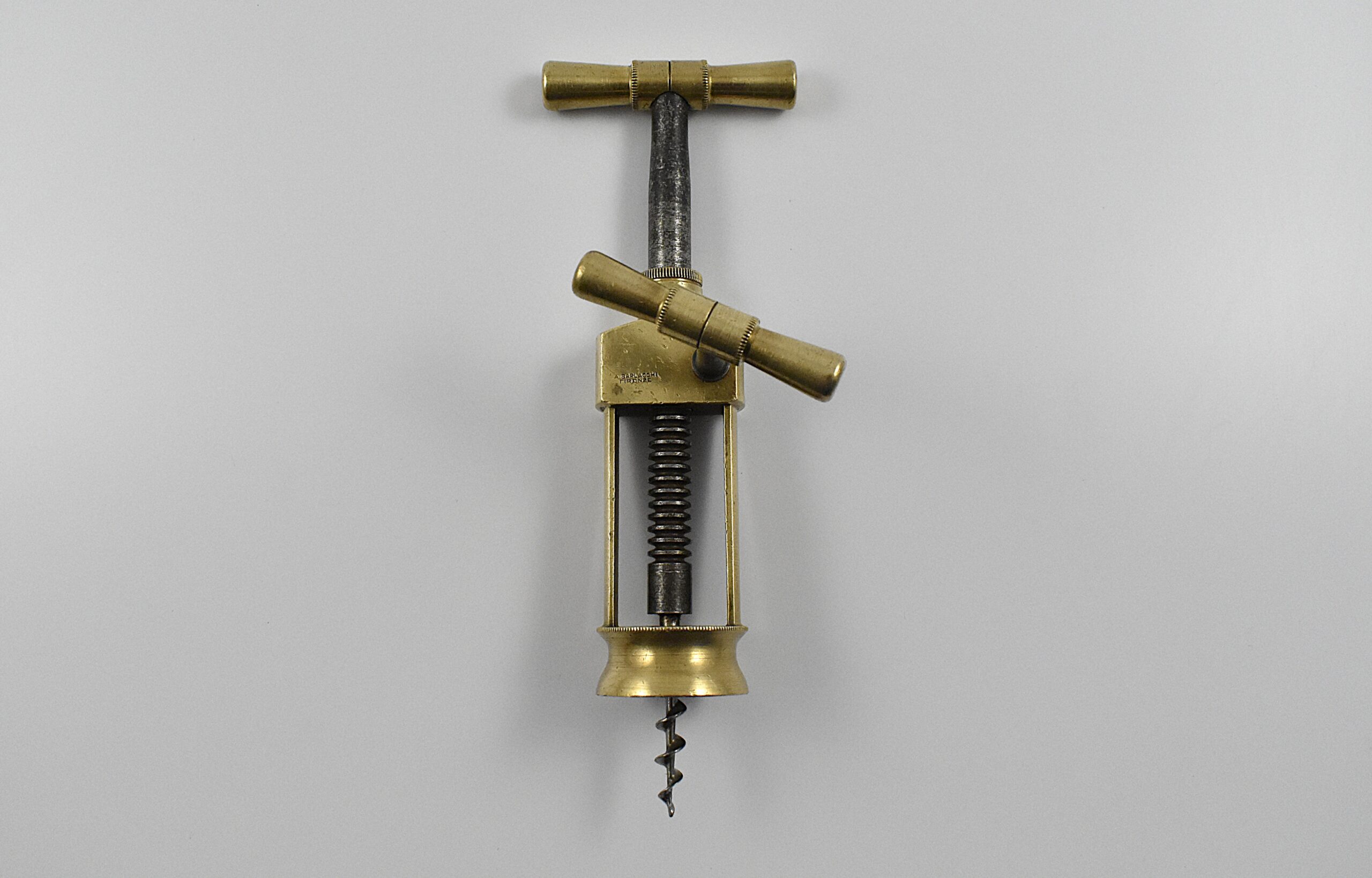 An Italian mechanical brass, two pillar open frame, rack corkscrew marked “A. BARLACCHI FIRENZE” on the frame.