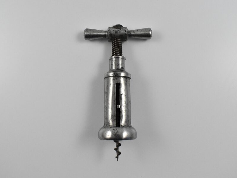 An Italian steel slotted closed barrel frame corkscrew marked “F TONELLI PARMA".