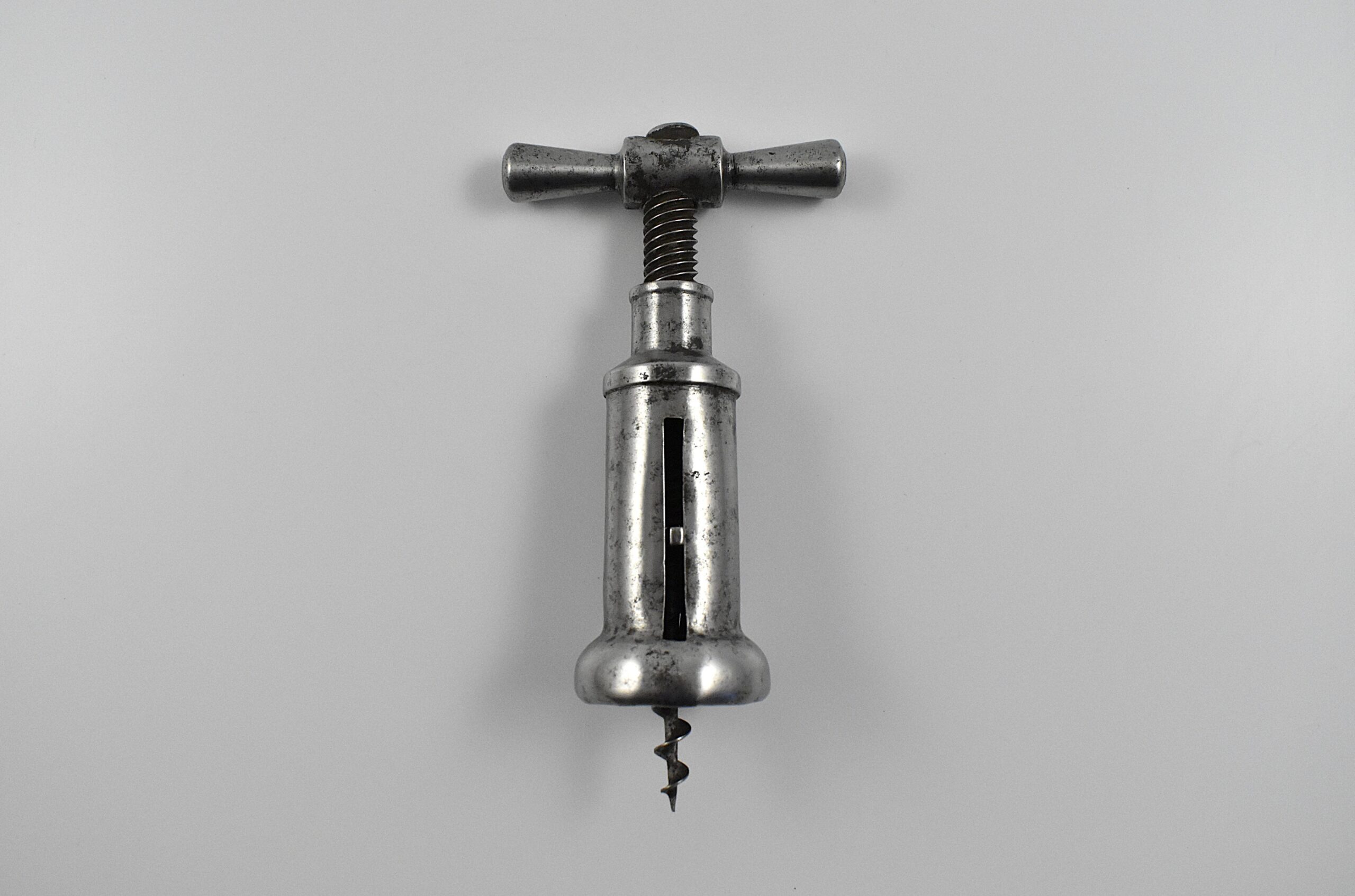 An Italian steel slotted closed barrel frame corkscrew marked “F TONELLI PARMA".