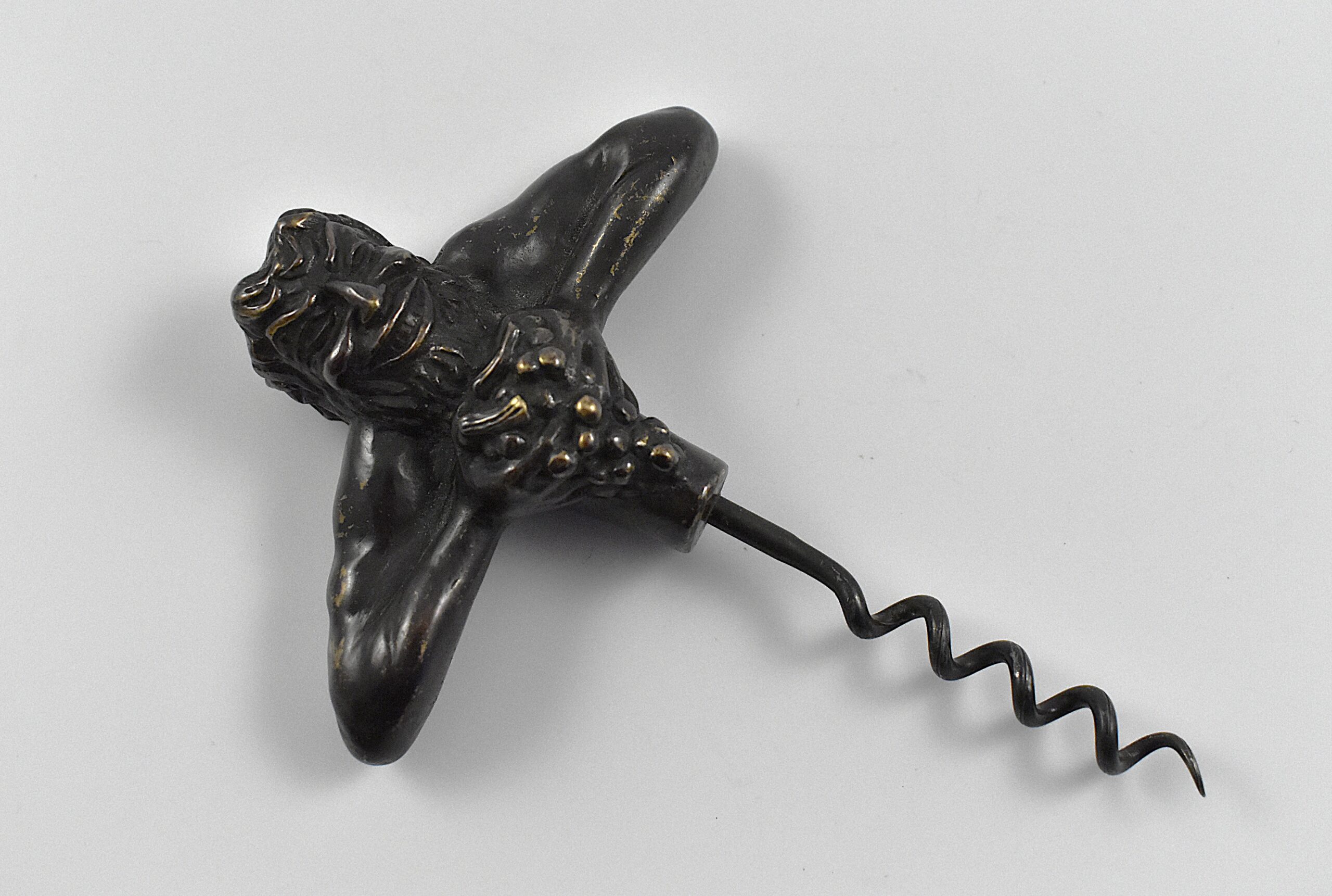 A bronze straight pull corkscrew with a representation of Bacchus squeezing a bunch of grapes. - Image 3