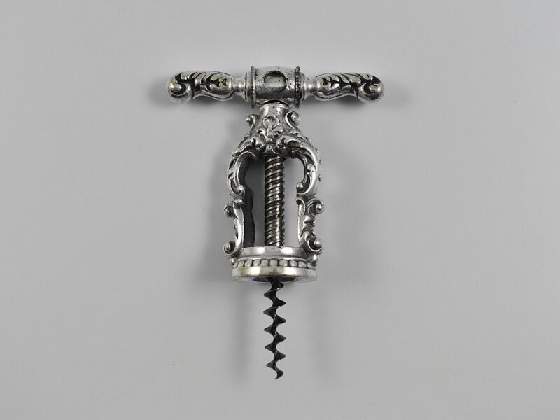 A German silver plated decorative open frame corkscrew known as Reissmann’s patent.