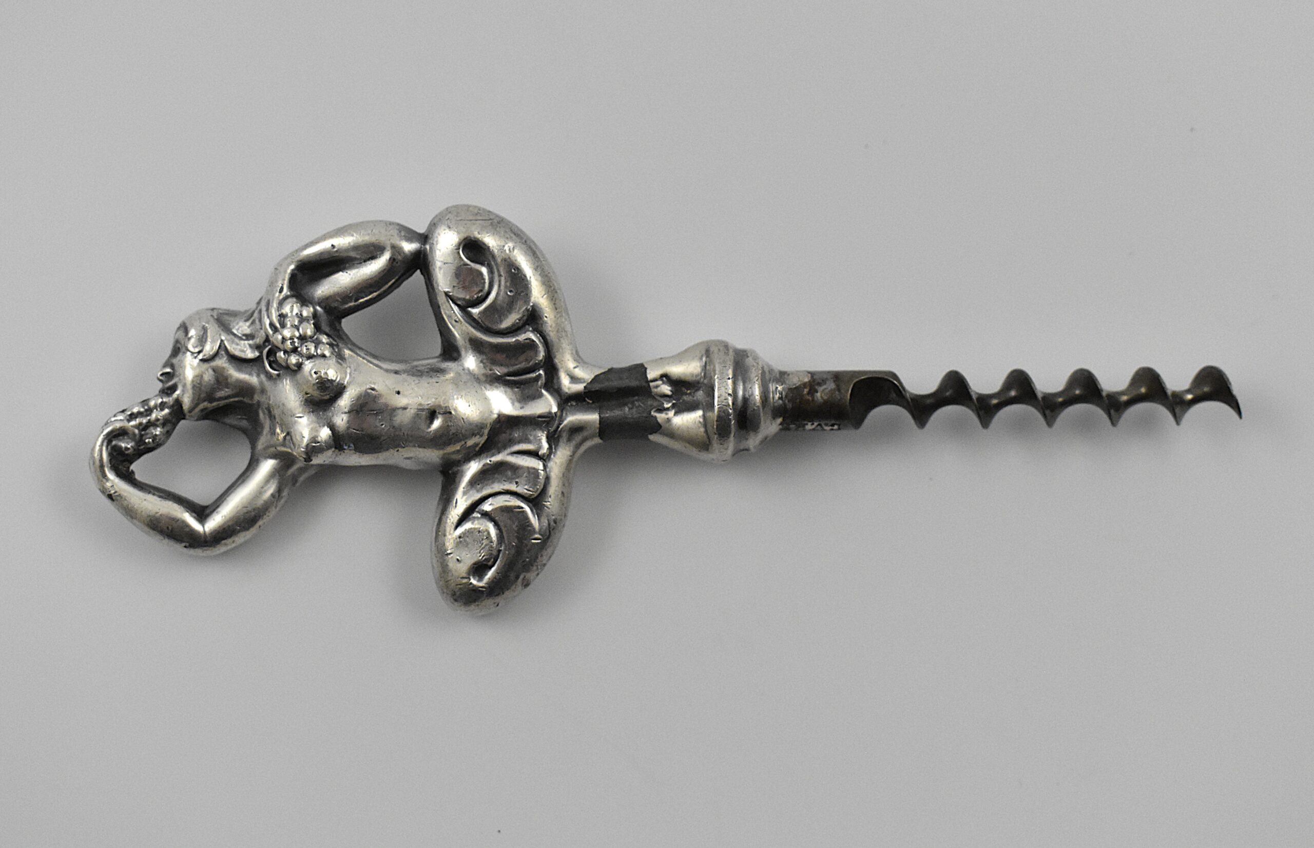 A Swedish straight pull corkscrew with a representation of a nude woman seductively eating grapes. This is marked “C.V.H” on the shank for the firm of Carl Victor Heljestrand (1816-1861). - Image 2