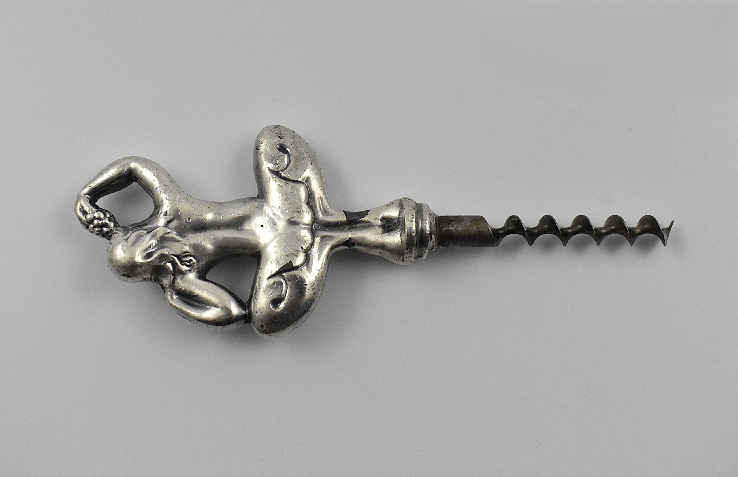 A Swedish straight pull corkscrew with a representation of a nude woman seductively eating grapes. This is marked “C.V.H” on the shank for the firm of Carl Victor Heljestrand (1816-1861). - Image 3
