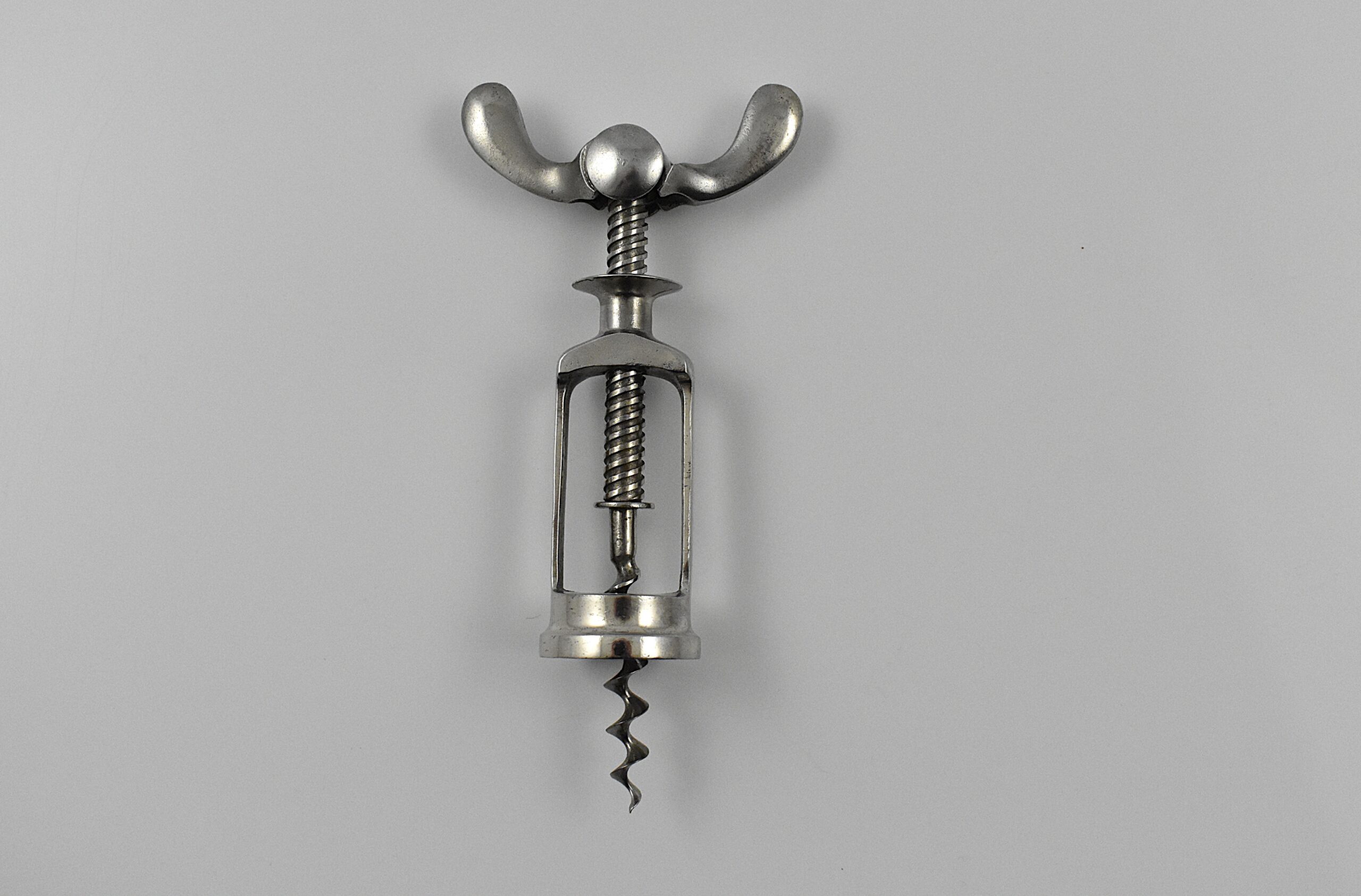 A chrome plated all steel mechanical corkscrew known as the ‘Bodega’. This was after Ernst Scharff’s 1899 German patent. This example marked “MADE ITALY” on the frame.