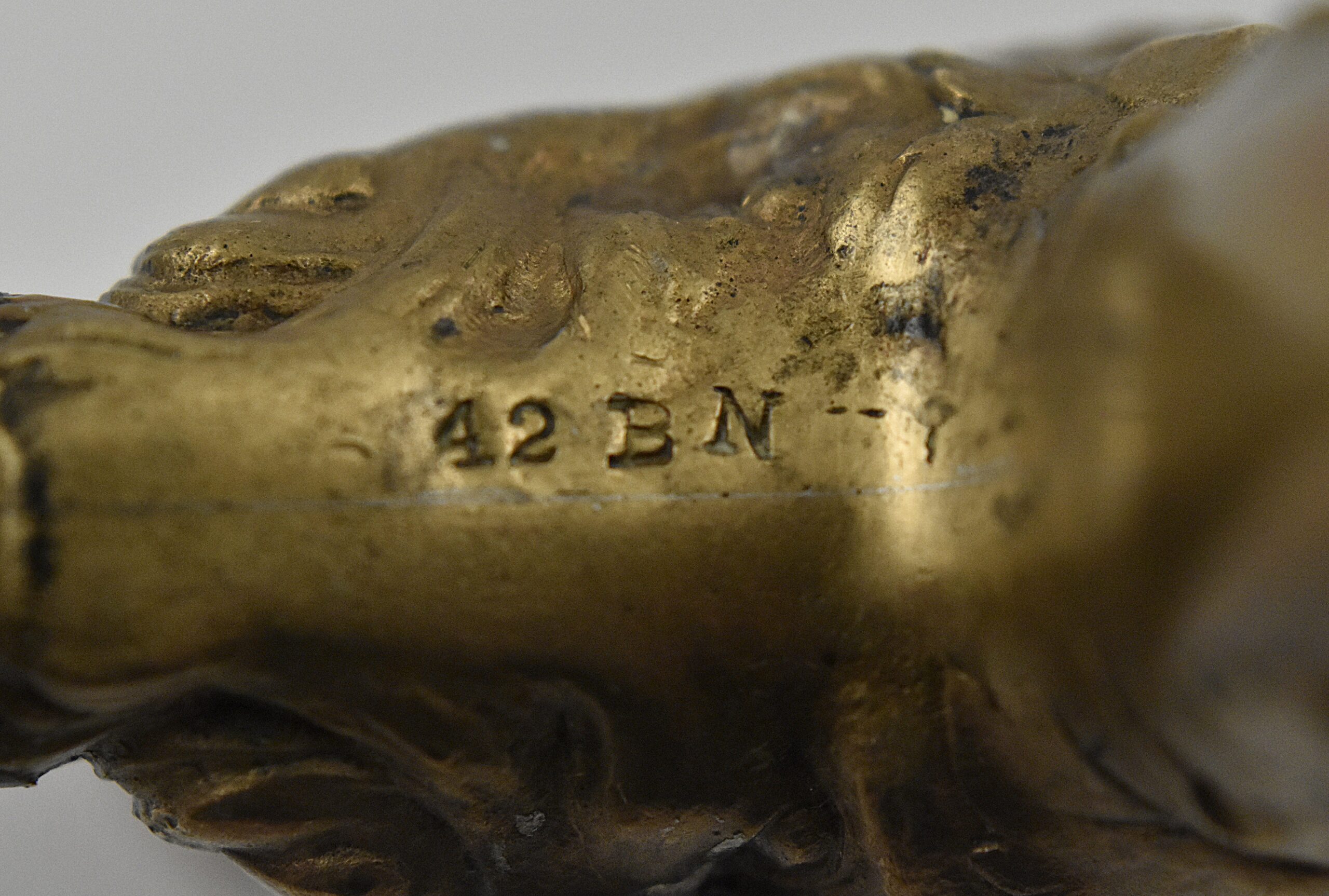 An American hollow brass handled bell cap corkscrew by Reed & Barton with internal rolling ball, the bell cap designed by Walker. The handle moulded with a figure of Baccus and grape vines and is marked “REED & BARTON’ on one side and “42 BN” on the other. - Image 3