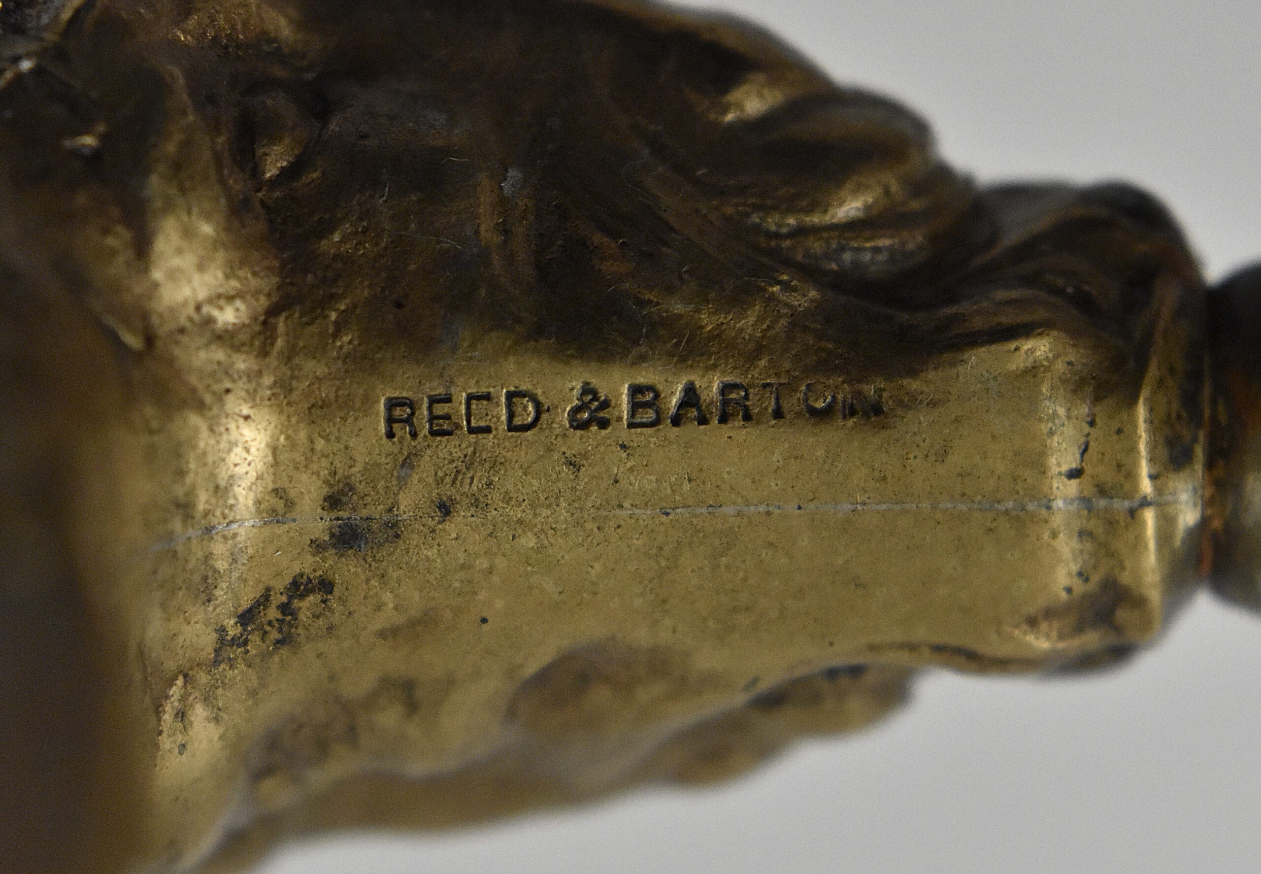 An American hollow brass handled bell cap corkscrew by Reed & Barton with internal rolling ball, the bell cap designed by Walker. The handle moulded with a figure of Baccus and grape vines and is marked “REED & BARTON’ on one side and “42 BN” on the other. - Image 4