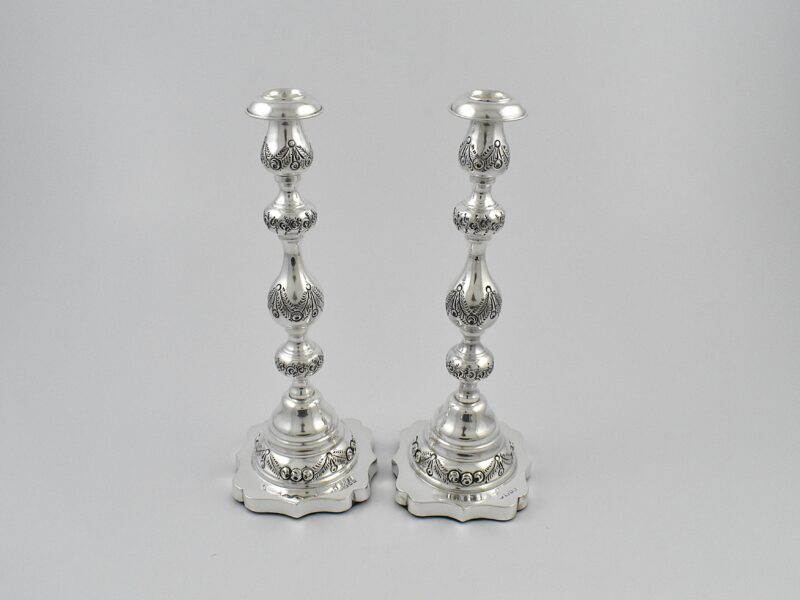 Pair of silver Sabbath candlesticks marked for London 1924 by Rosenzweig, Taitelbaum & Co.